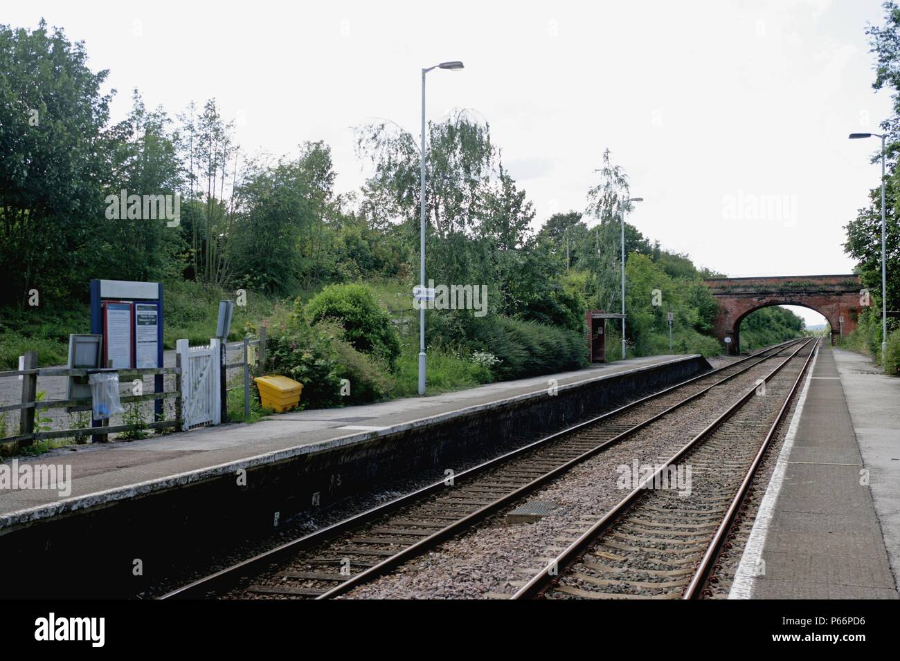 General view of the platforms and lighting at Elton and Orston station, Lincolnshire showing information signs and timetables. 2007 Stock Photo