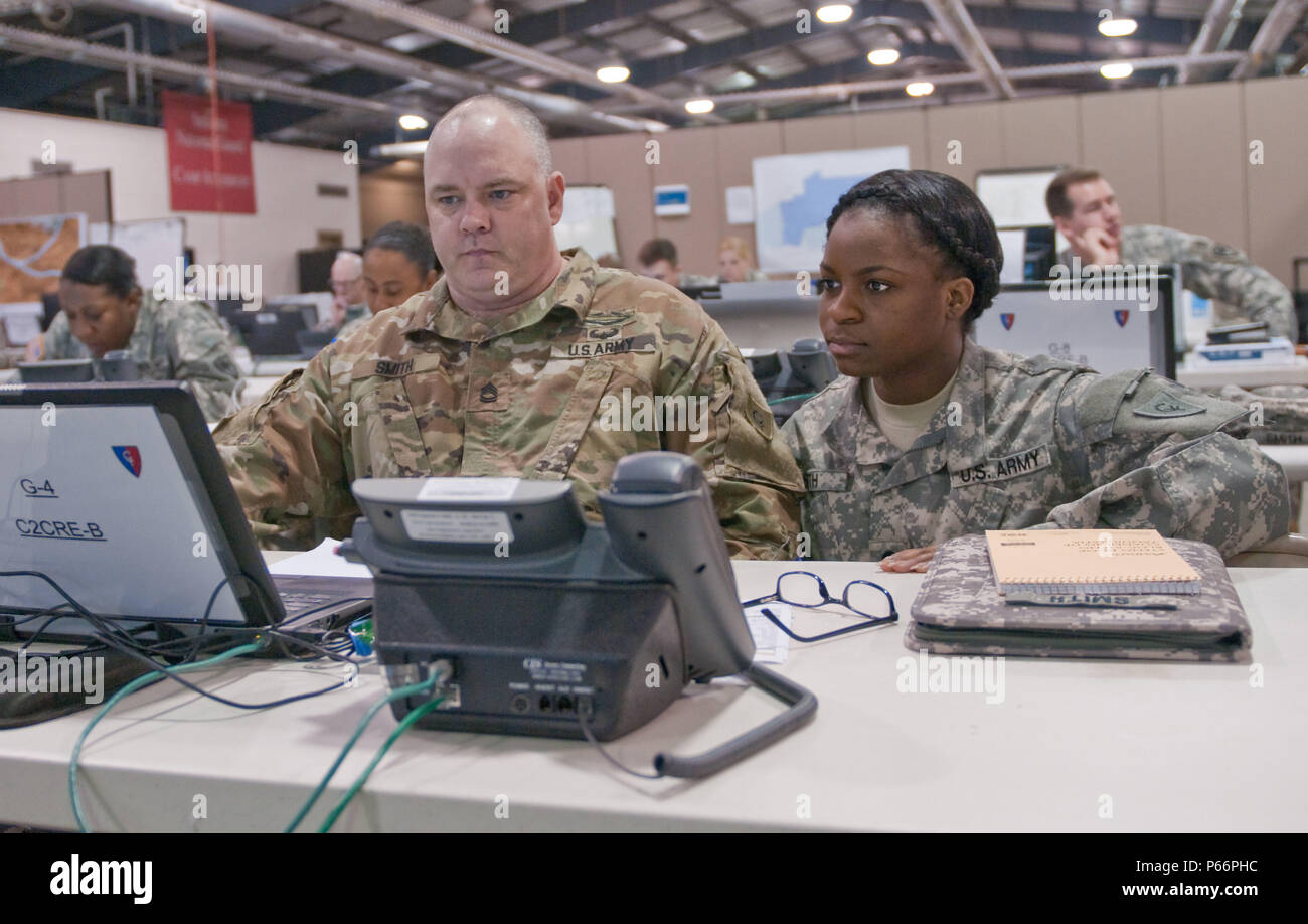 Sgt. 1st Class Shad Smith (left), of Houston, Texas, logistics communications liaison and Spc. Latosha Smith, of Indianapolis, Indiana, logistics communications liaison assistant, both with Task Force 38, work to identify what food, water and supplies are needed at a simulated emergency shelter May 13, 2016, during the Vibrant Response exercise. Vibrant Response is a U.S. Northern Command-sponsored training exercise for contingency planning and response forces designed to improve their ability to respond to catastrophic incidents. (Photo by Sgt. Juana M. Nesbitt, 7th Mobile Public Affairs Deta Stock Photo