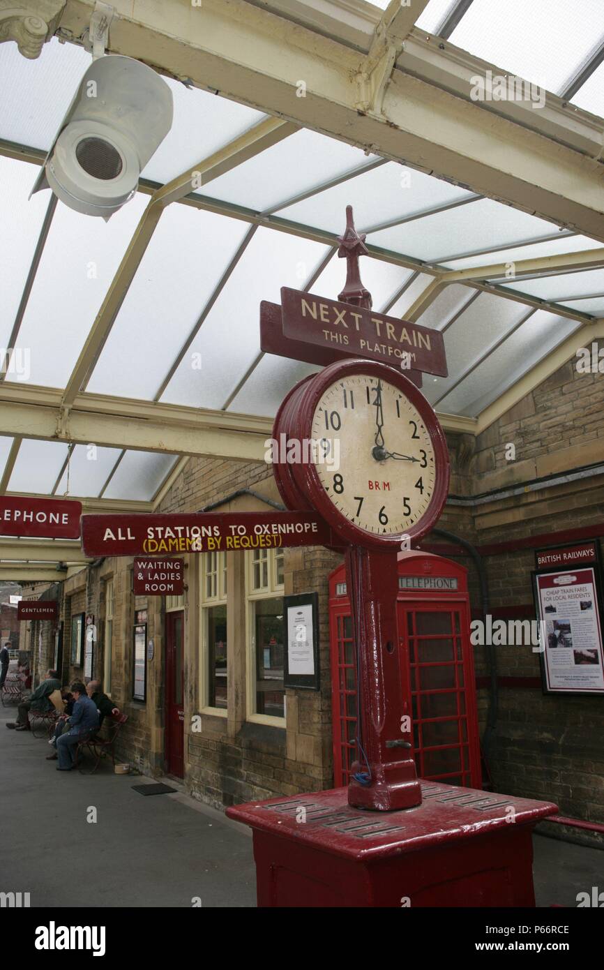 Old clock and heritage signage at Keighley station on the Keighley and Worth Valley Railway, Yorkshire. 2007 Stock Photo