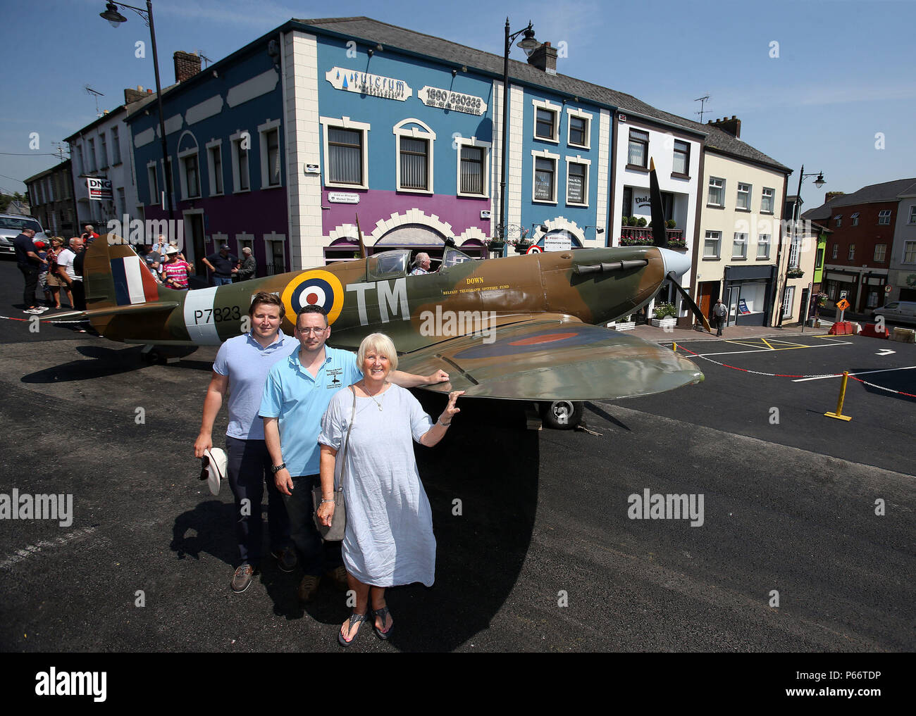 Sarah Tysoe, niece of pilot of the 'Monaghan Spitfire' Flight Lieutenant Gordon Hayter Proctor, along with her son George Tysoe (left) and aviation historian Jonny McNee with a replica spitfire at the launch of the exhibition 'The Monaghan Spitfire: Life on the Border with a World War' at the Monaghan County museum. Stock Photo
