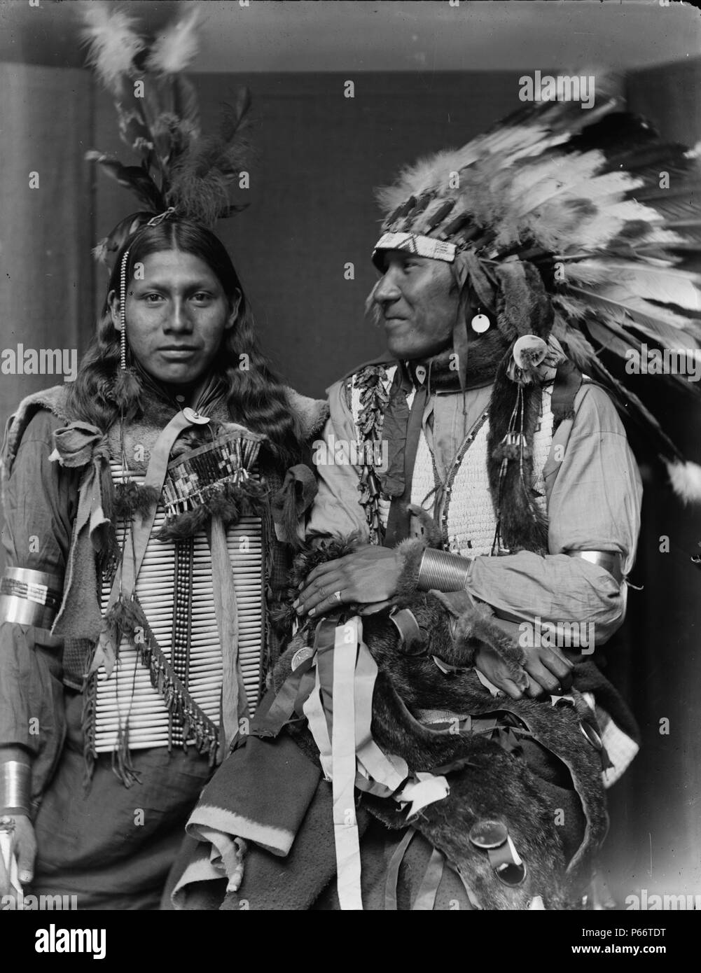 American Indians by Photographer Gertrude Käsebier, 1852-1934. Holy Frog (left) and Big Turnips were probably members of Buffalo Bill's Wild West Show, half-length portrait, one wearing a headdress. Dated ca. 1900 Stock Photo