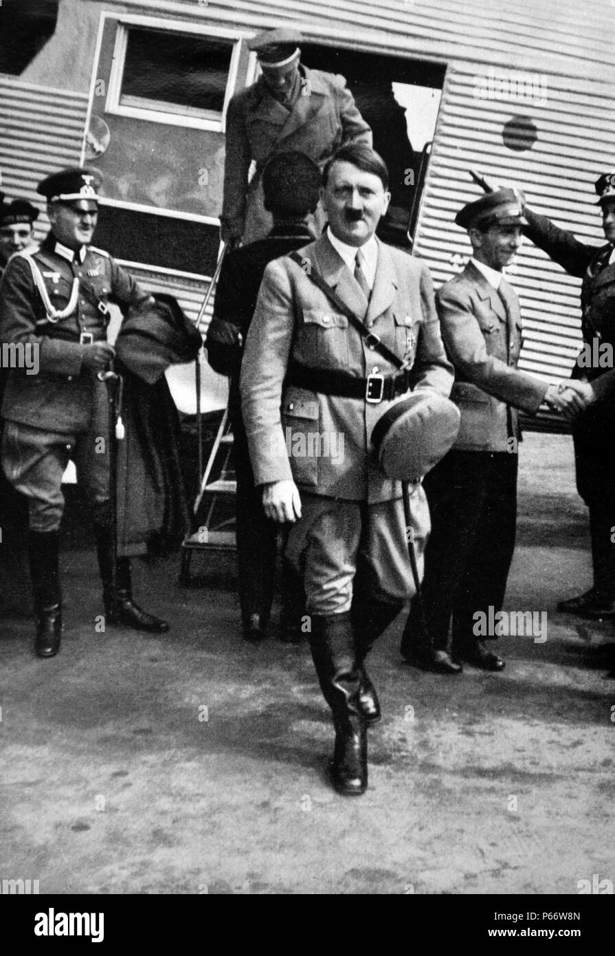 Adolf Hitler arriving at an airfield in Germany accompanied by Dr Josef Goebbels Stock Photo