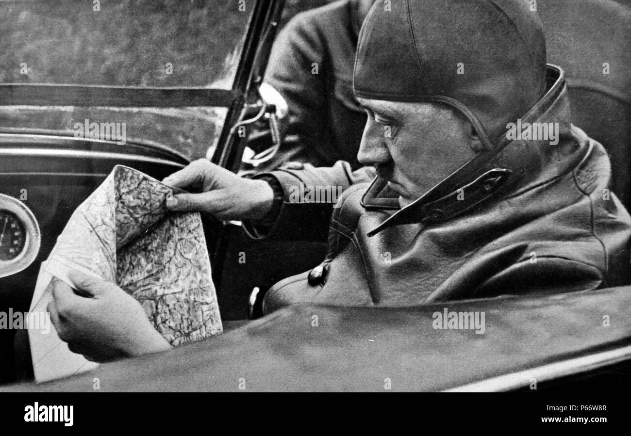 Adolf Hitler 1889-1945. driving on holiday near a country retreat. German politician and the leader of the Nazi Party driving a car. He was chancellor of Germany from 1933 to 1945 and dictator of Nazi Germany from 1934 to 1945. Stock Photo