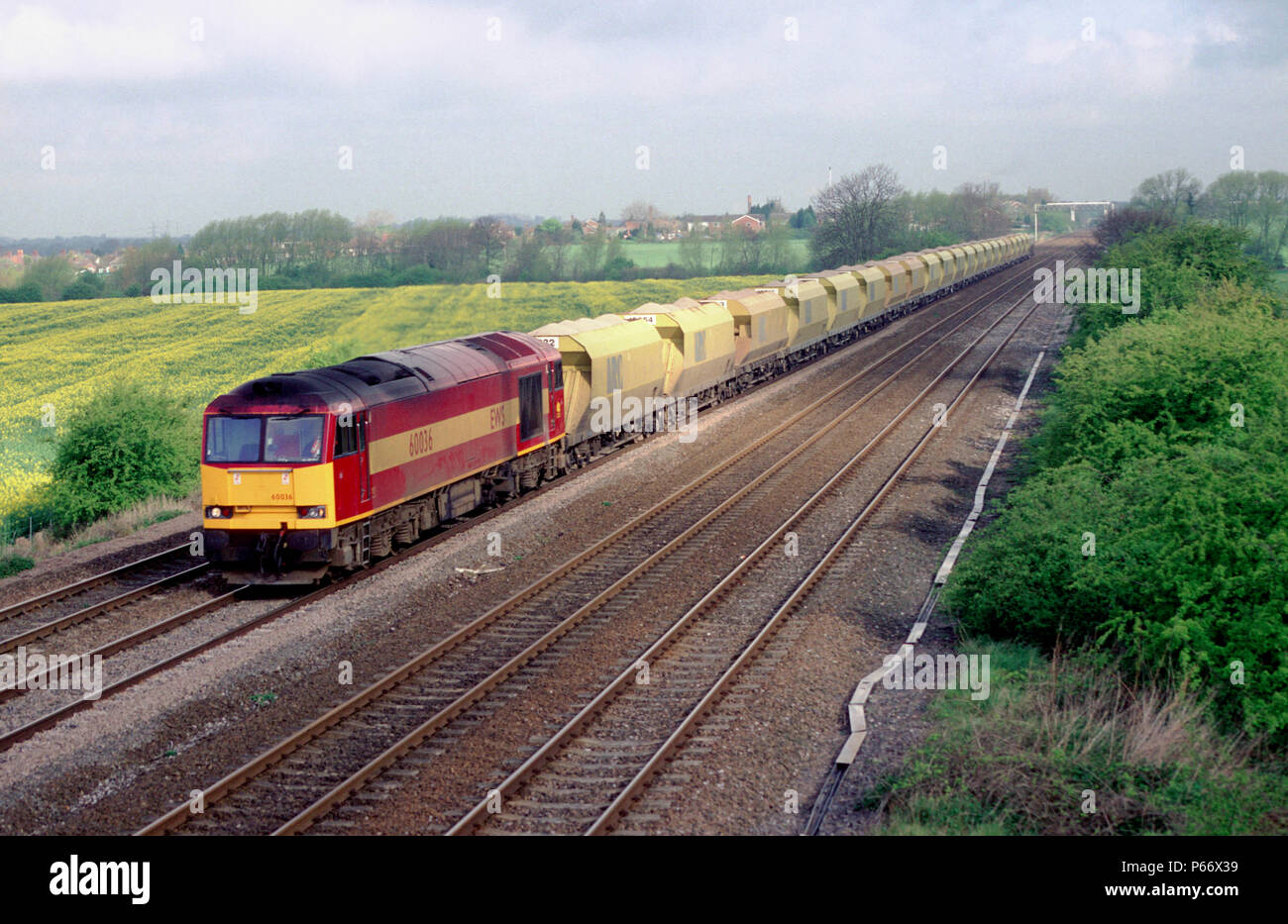 A class 60 EWS locomotive is seen here hauling ARC stone wagons at Cossington, Leicestershire. 23rd April 1998. Stock Photo