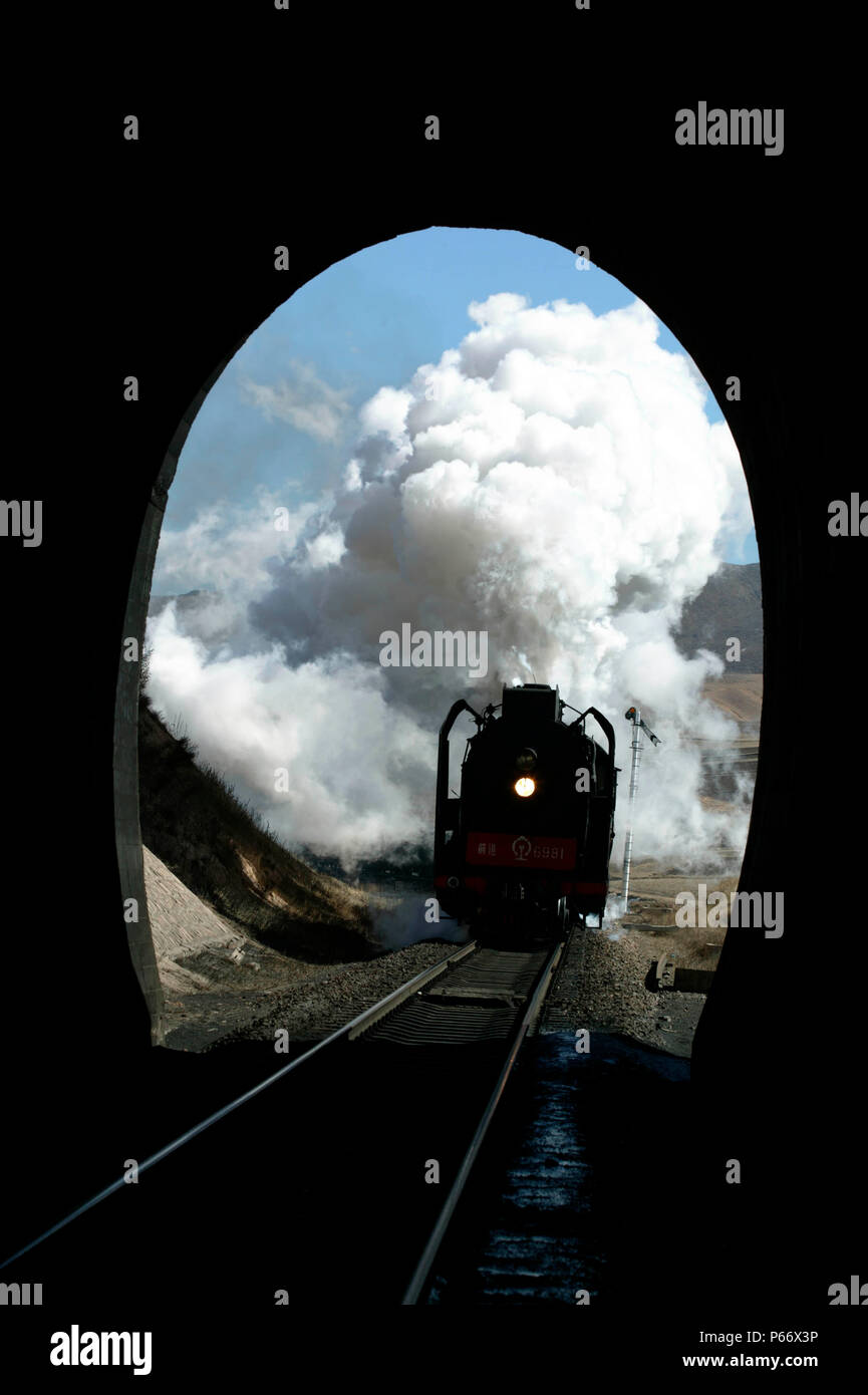 A Daban to Holoku freight passes the distance signal for Shangdian and prepares to enter the summit tunnel, picture dated 2004. Stock Photo