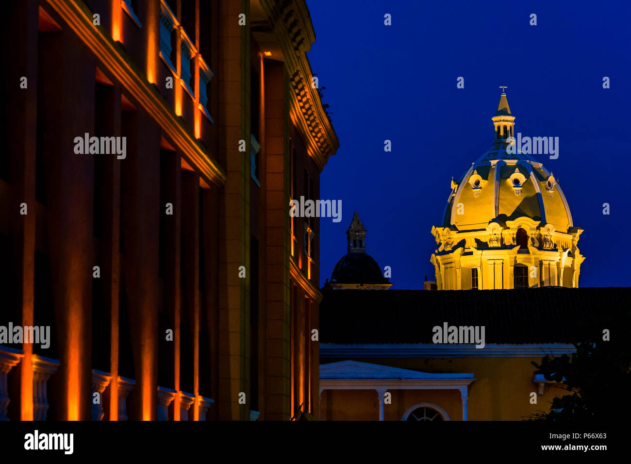 The cupola of Iglesia de San Pedro Claver (the San Pedro Claver Church) is seen enlightened during the twilight in Cartagena, Colombia. Stock Photo