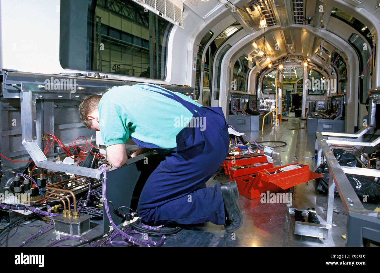 Assembly worker at work on new London Underground stock at BREL, Derby ...