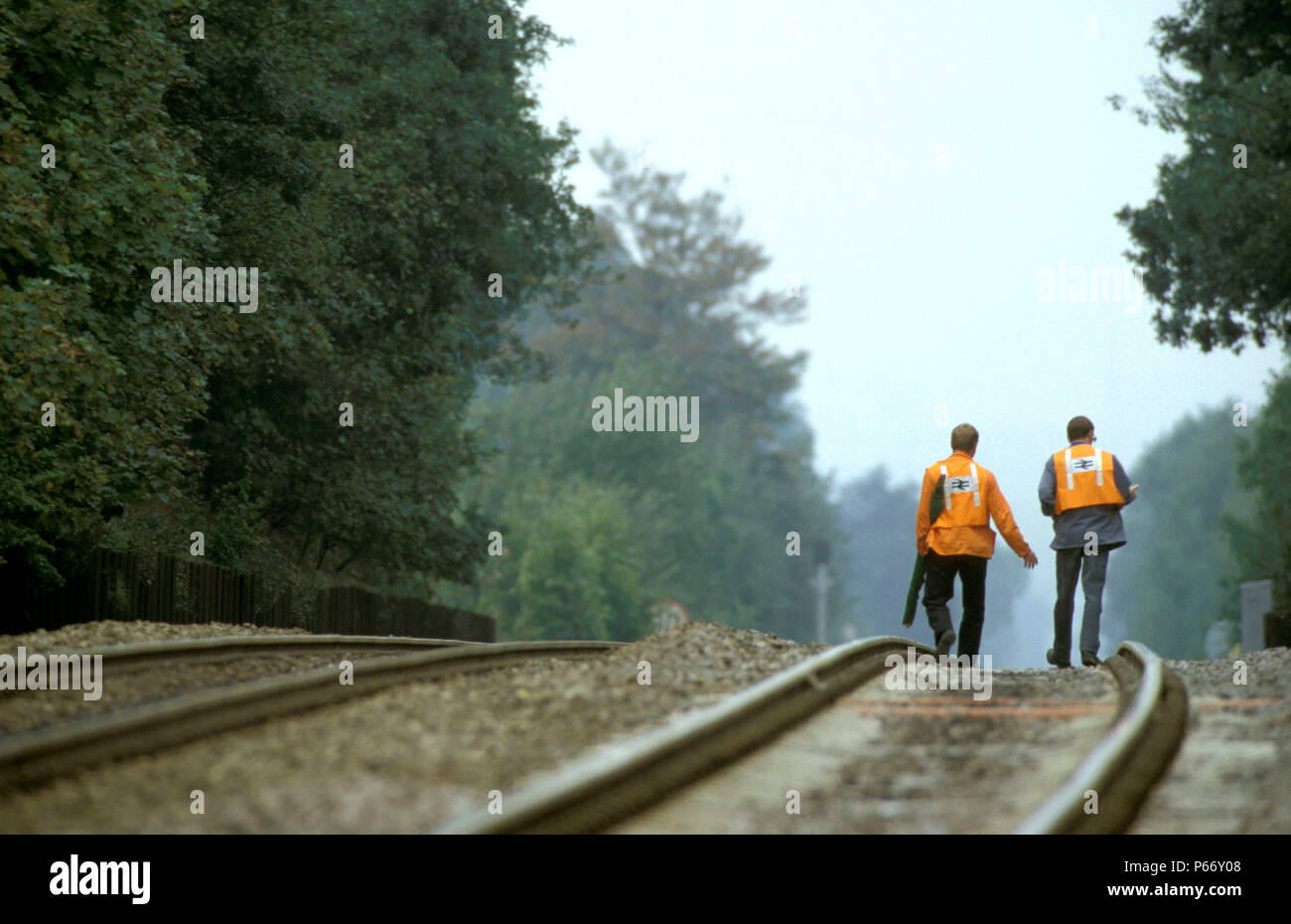Engineers inspect the track on foot on Britain's steepest main line incline at Lickey Bank in Worcestershire, England. C2001 Stock Photo