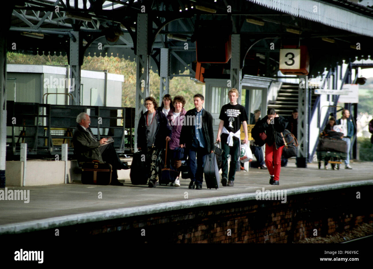 Passengers awaiting the arrival of their train at Truro station