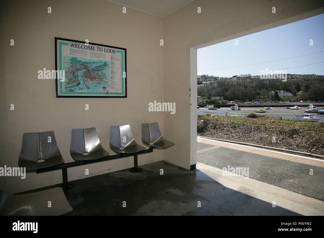 Seating and map inside the waiting shelter at Looe station at the end of the Liskeard to Looe branch line, Cornwall. 2006 Stock Photo