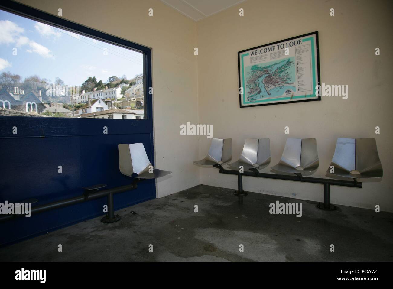 Seating and map inside the waiting shelter at Looe station at the end of the Liskeard to Looe branch line, Cornwall. 2006 Stock Photo