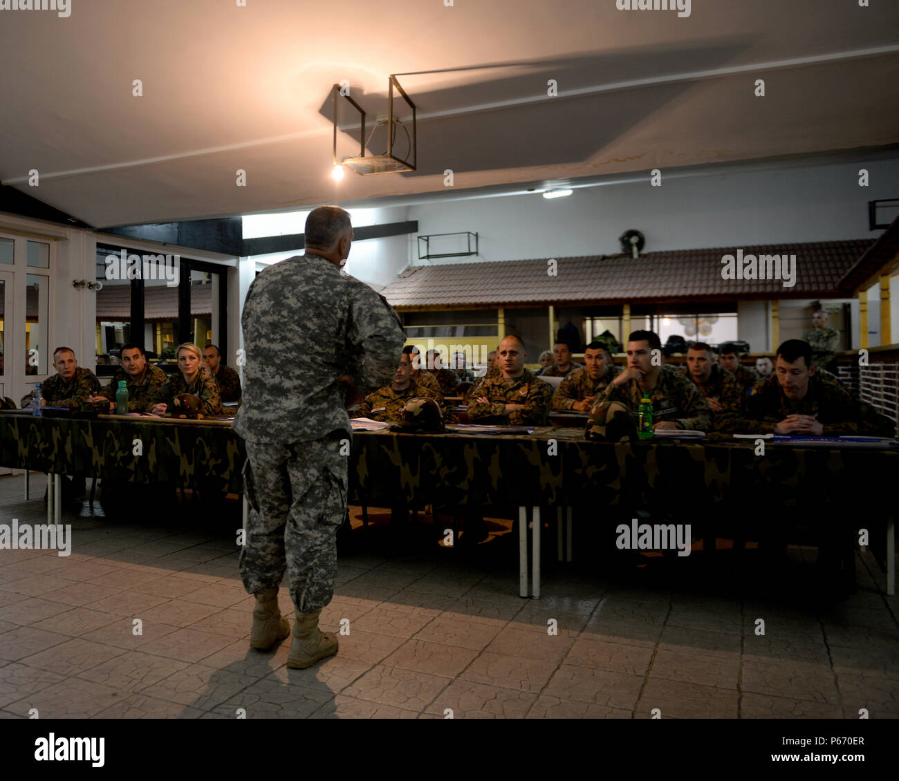 U.S. Army Command Sgt. Maj. Harley Schwind, NATO Headquarters Sarajevo senior enlisted leader, teaches a class to 40 soldiers from the Bosnia and Herzegovina Armed Forces at the Rajlovac Barracks in Sarajevo, BiH, May 11, 2016. Sergeant Major Schwind was briefing as part of the AFBiH Primary Leadership Development Course, a five-week course designed to provide young soldiers with the knowledge and skills to be future NCOs. The sergeant major is a Mandan, N.D., native deployed from the North Dakota Army National Guard. Stock Photo