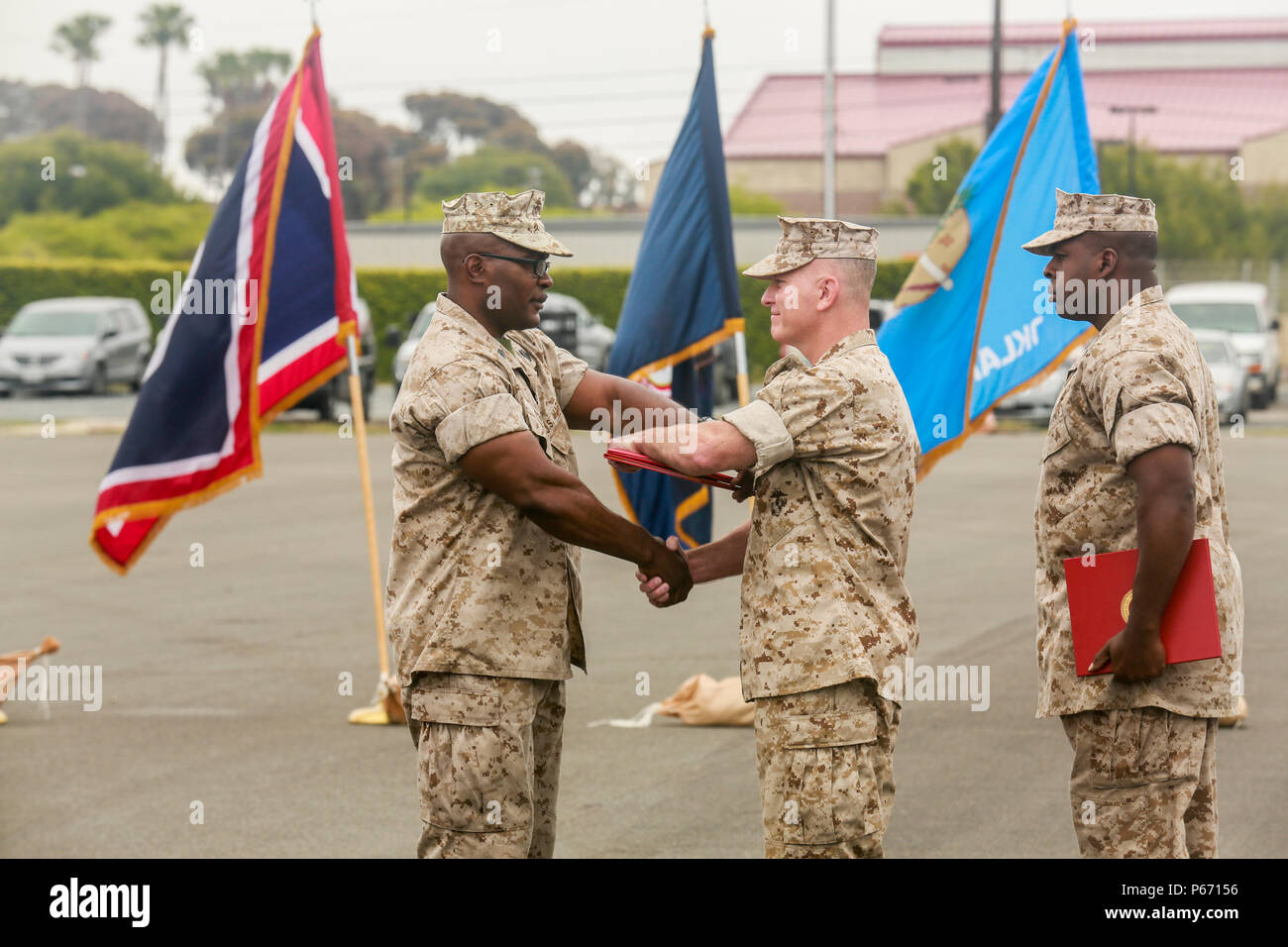 U.S. Marine Master Sgt. Gregory Byrd is presented with the fourth Navy Marine Cops Commendation Medal of his career by Col. James P. Fallon, 15th Marine Expeditionary Unit commanding officer, during Byrd’s retirement ceremony aboard Marine Corps Base Camp Pendleton, Calif., May 13, 2016.  Byrd received the award for his actions during the final tour of his 23 years of faithful service to Corps and country.  (U.S. Marine Corps photo by Sgt. Jamean R. Berry/Released) Stock Photo