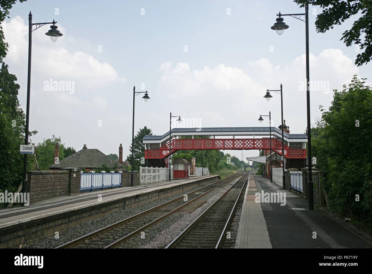 View of the platforms and newly refurbished lighting and footbridge at Codsall station, Staffordshire. 2007 Stock Photo
