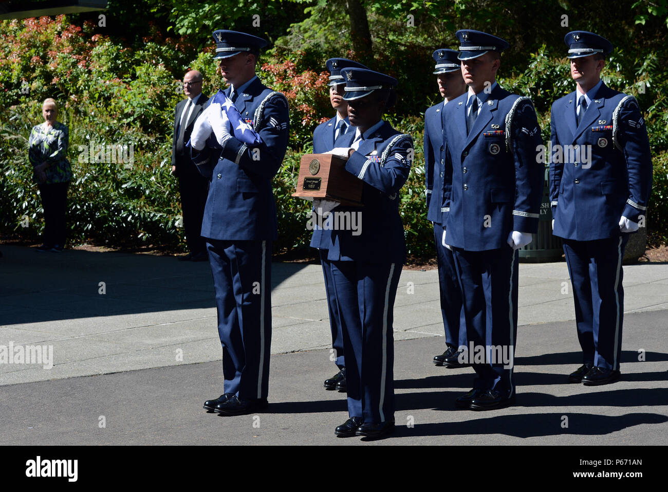 Ceremonial guardsmen from the McChord Field Honor Guard, transport the remains of Airman Second