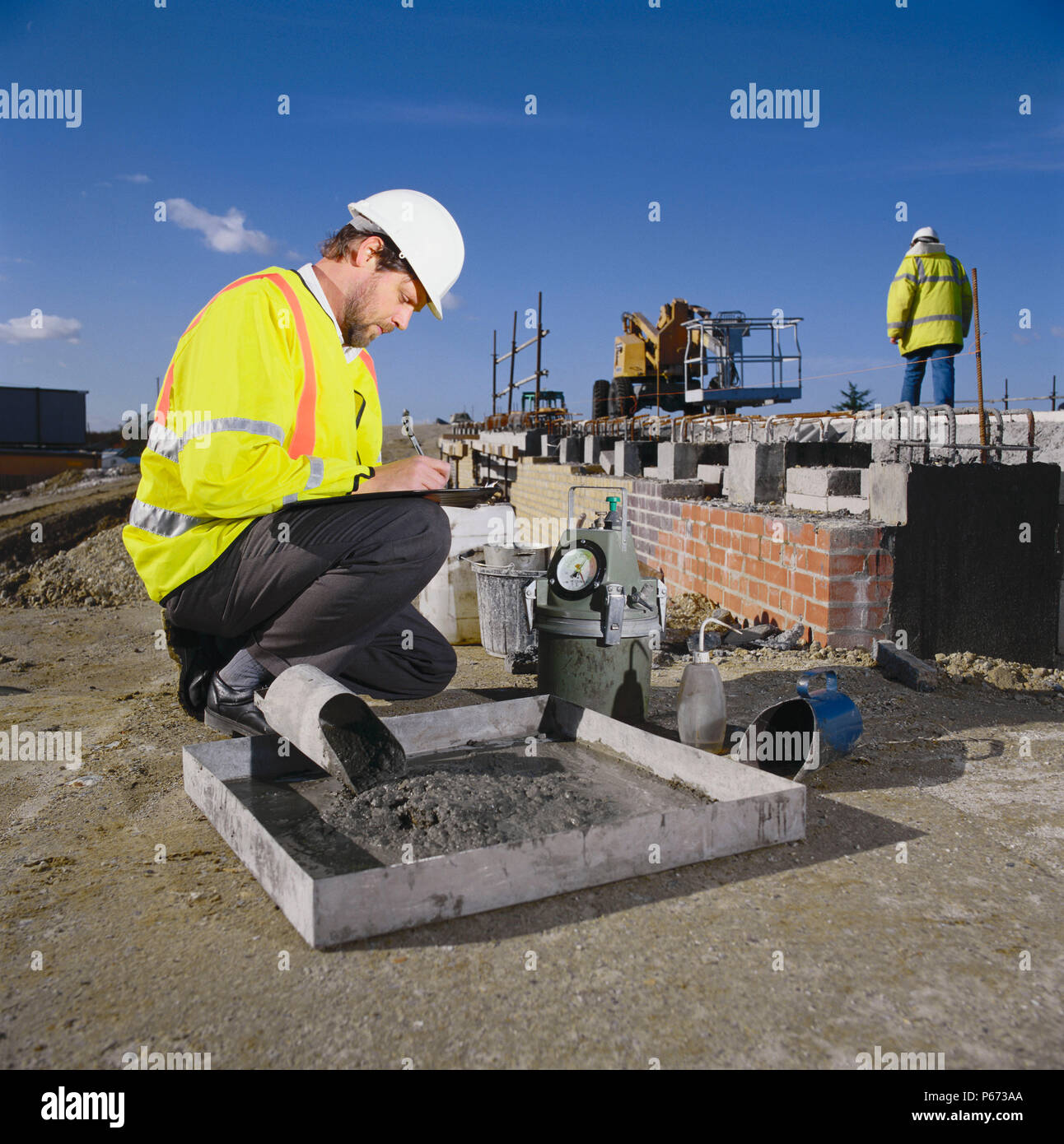 Engineer takes reading of concrete quality Stock Photo Alamy