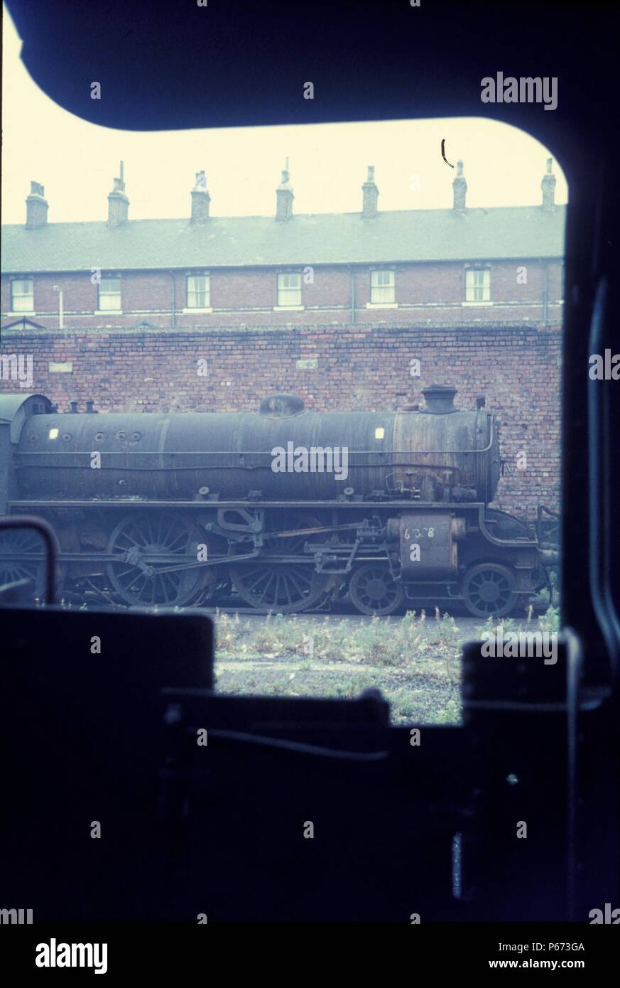 A withdrawn former LNER B1 Class 4-6-0 at Low Moor depot. A view from the cab of an adjacent locomotive. Stock Photo