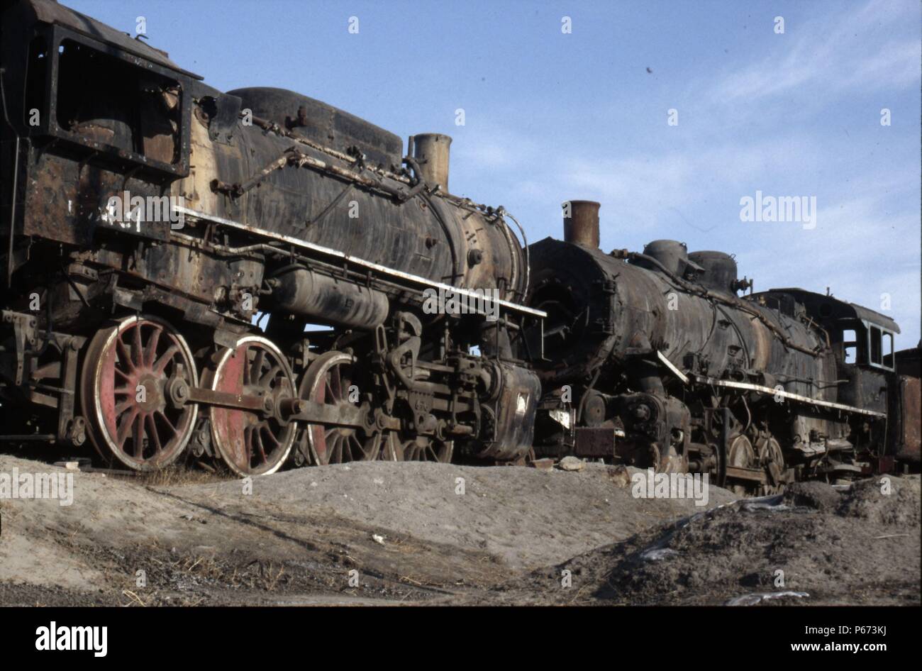 American thoroughbreds at Manzhouli on China's Russian border in Inner Mongolia as a former United States Army Transportation Corps S160 Class 2-8-0 l Stock Photo