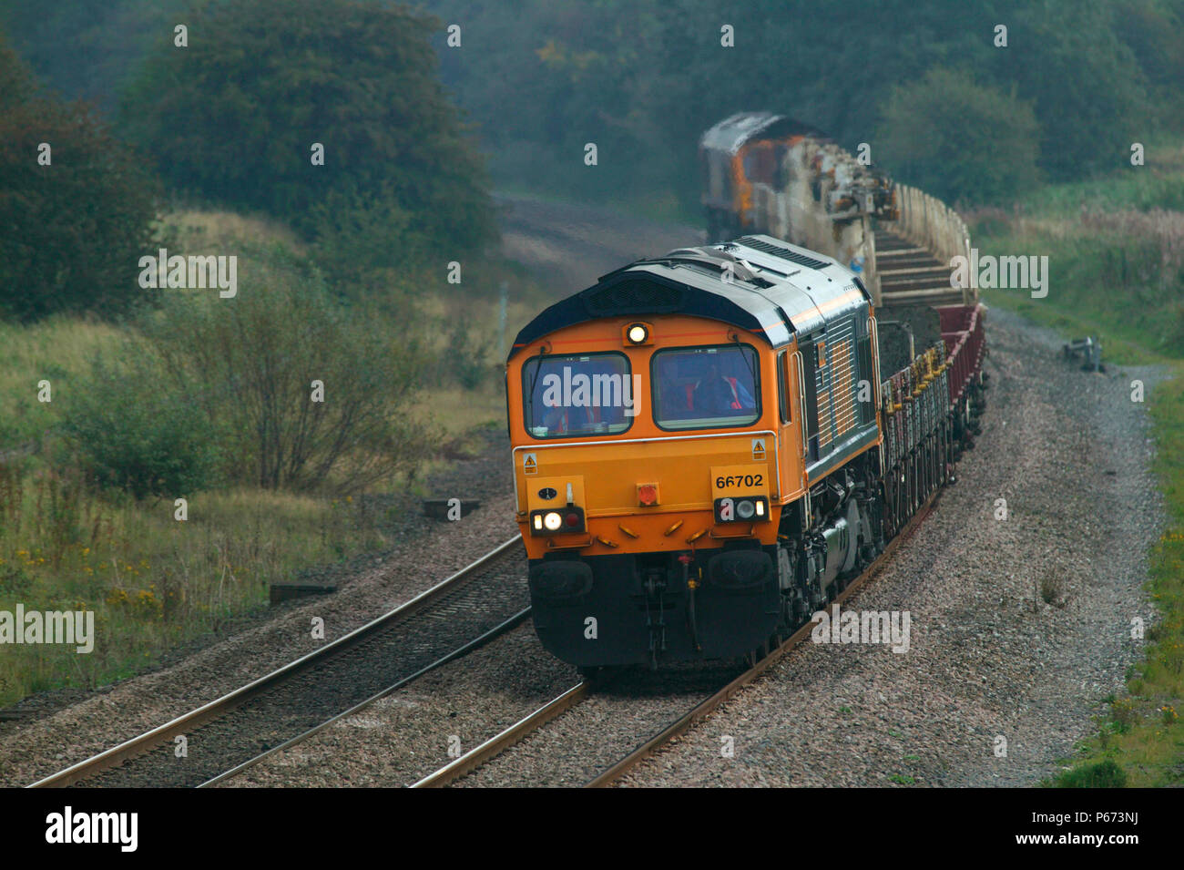 An engineer's train topped and tailed by GBRf class 66 diesel electrics pass through Kibworth on the Midland Main Line on Friday 10th September 2004. Stock Photo