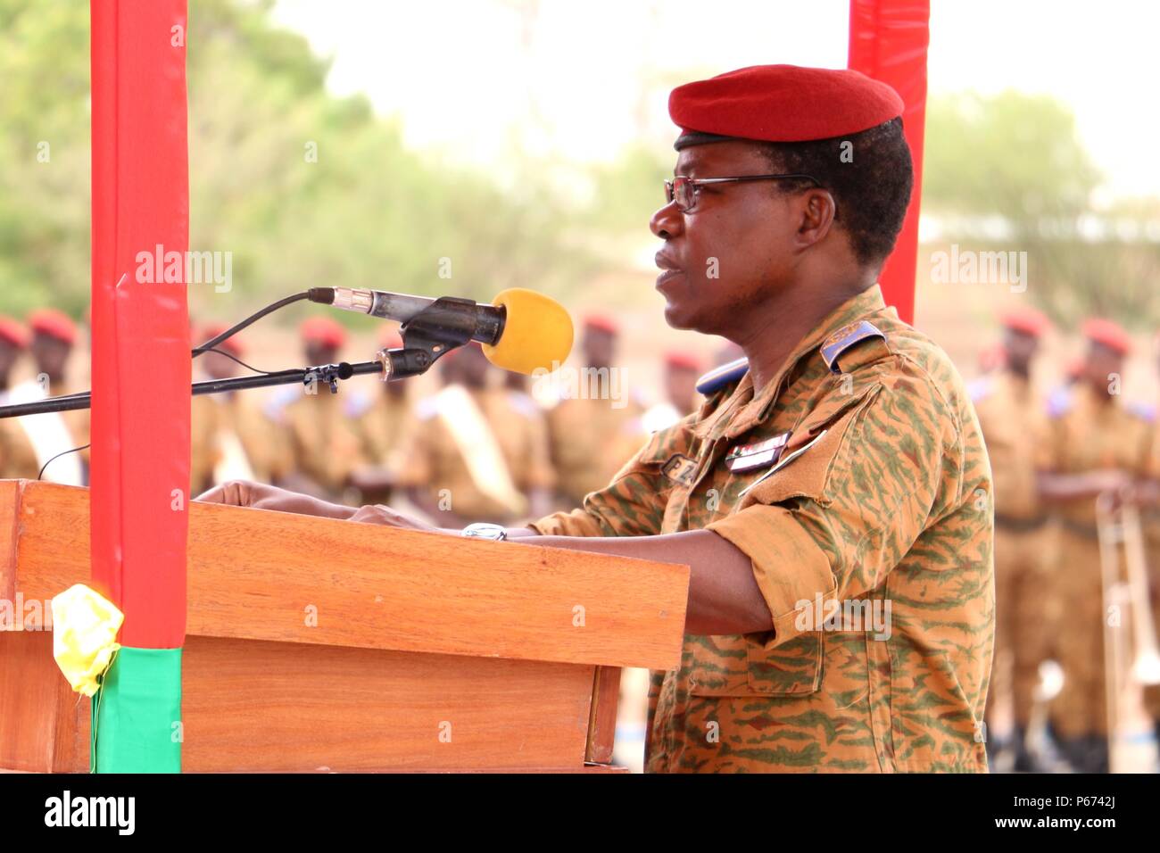 General Pingrenoma Zagre, Chief of Defense Staff for Burkina Faso Armed Forces, addresses dignitaries and multinational military leaders during the Western Accord 2016 Closing Day Ceremony May 13, 2016 at Camp Zagre, Ouagadougou, Burkina Faso. The two-week command post exercise, which began May 2, brought together 15 West African Nations, 7 NATO European countries and the U.S. to work as a multinational headquarters to build interoperability and shared understanding. (U.S. Army photo by Staff Sgt. Candace Mundt/Released) Stock Photo