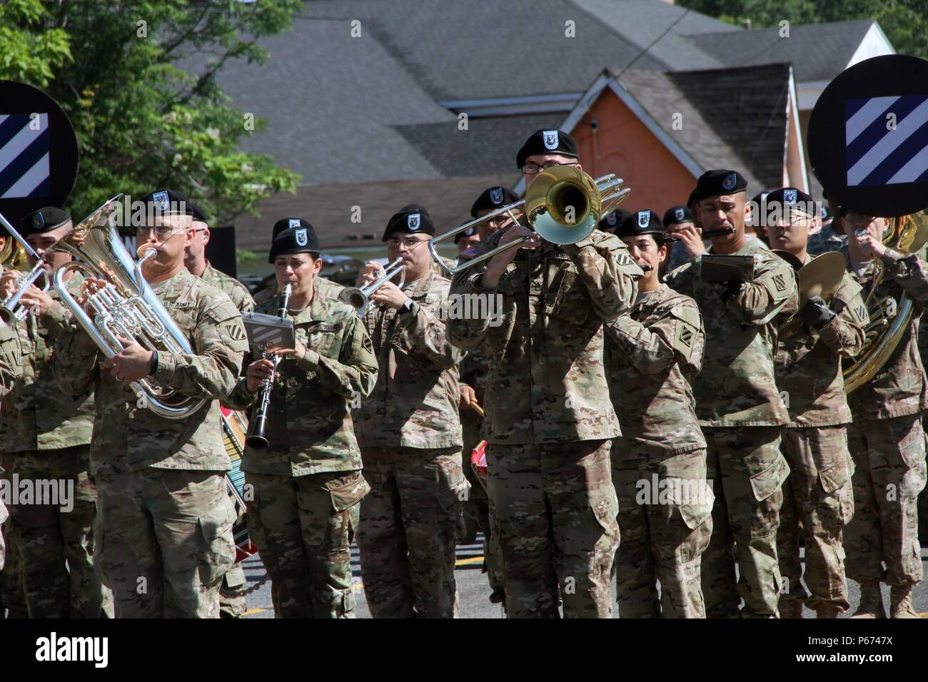 Soldiers of the 3rd Infantry Division band play their instruments and march in the Glennville