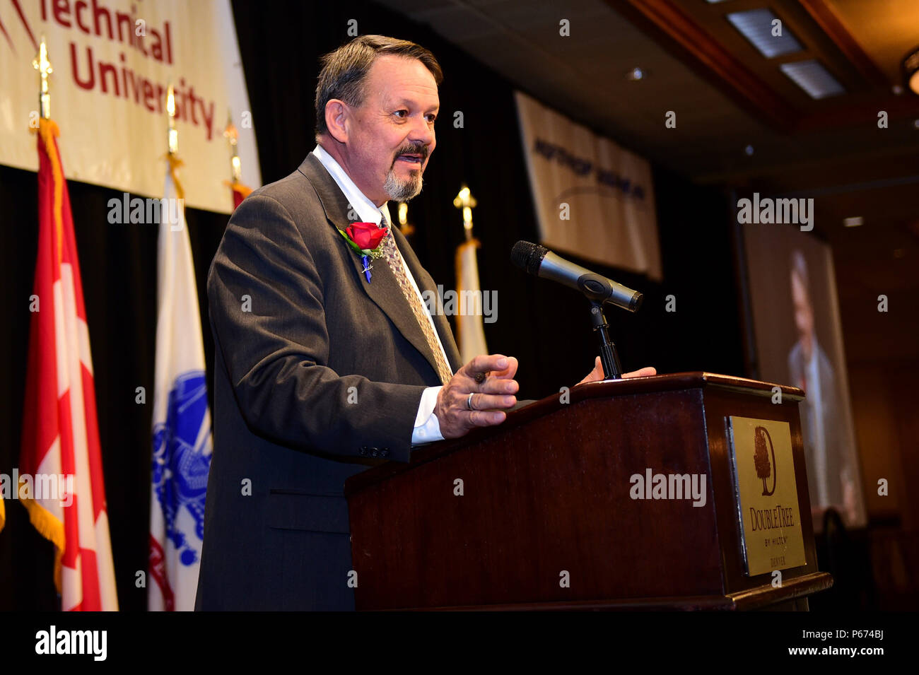 Rick Crandell, master of ceremonies, speaks May 13, 2016, during the Armed Forces Recognition Luncheon at the Doubletree Stapleton Hotel in Denver. The luncheon recognized outstanding Service members from all branches of service including active duty, guard and reserve components. (U.S. Air Force photo by Airman 1st Class Gabrielle Spradling/Released) Stock Photo