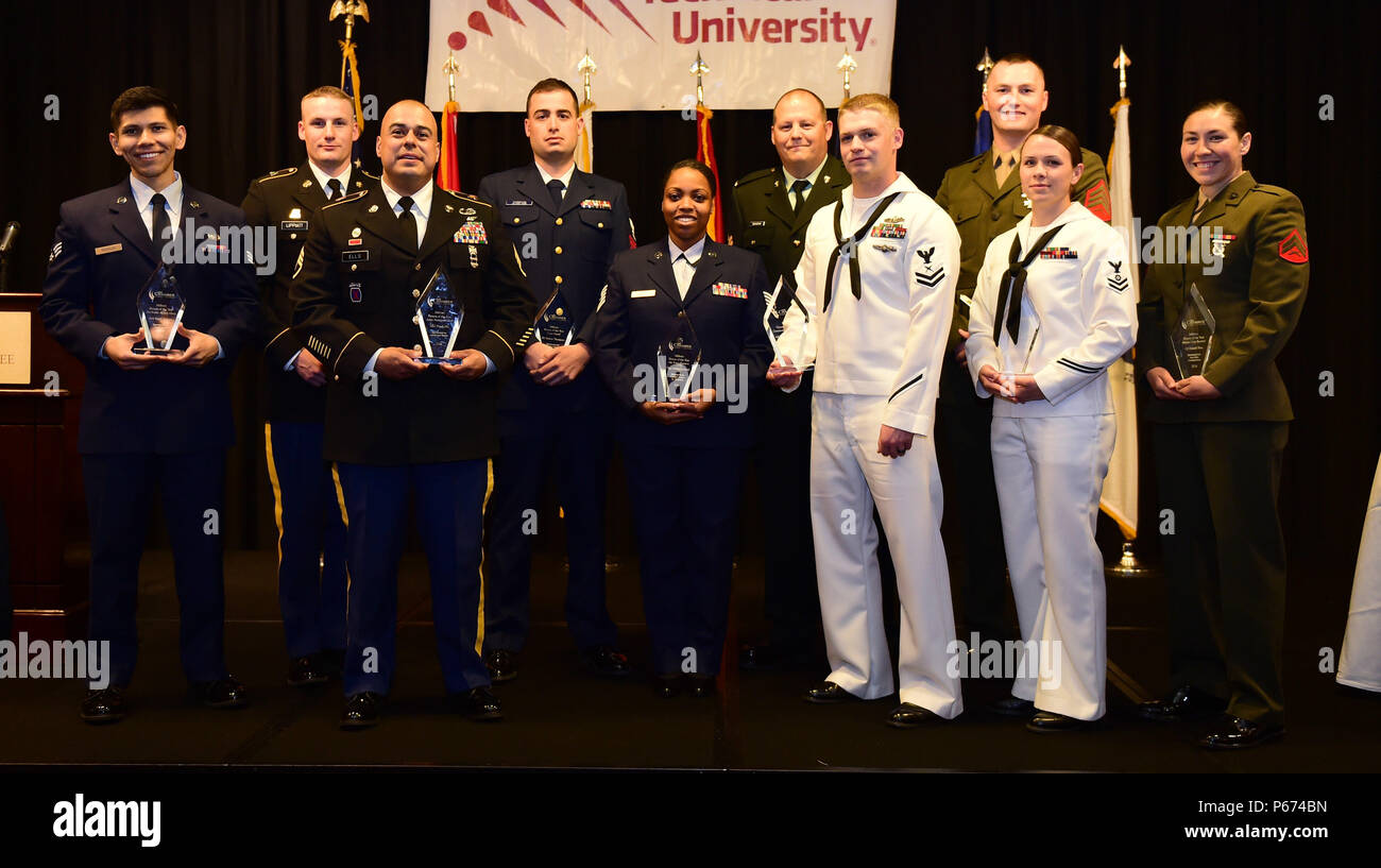 Award winners stand together May 13, 2016, after the Armed Forces Recognition Luncheon at the Doubletree Stapleton Hotel in Denver. The Aurora Chamber of Commerce along with local businesses hosts the annual lunch to recognize and honor the growing number of active duty, guard and reserve Service members throughout the area. (U.S. Air Force photo by Airman 1st Class Gabrielle Spradling/Released) Stock Photo