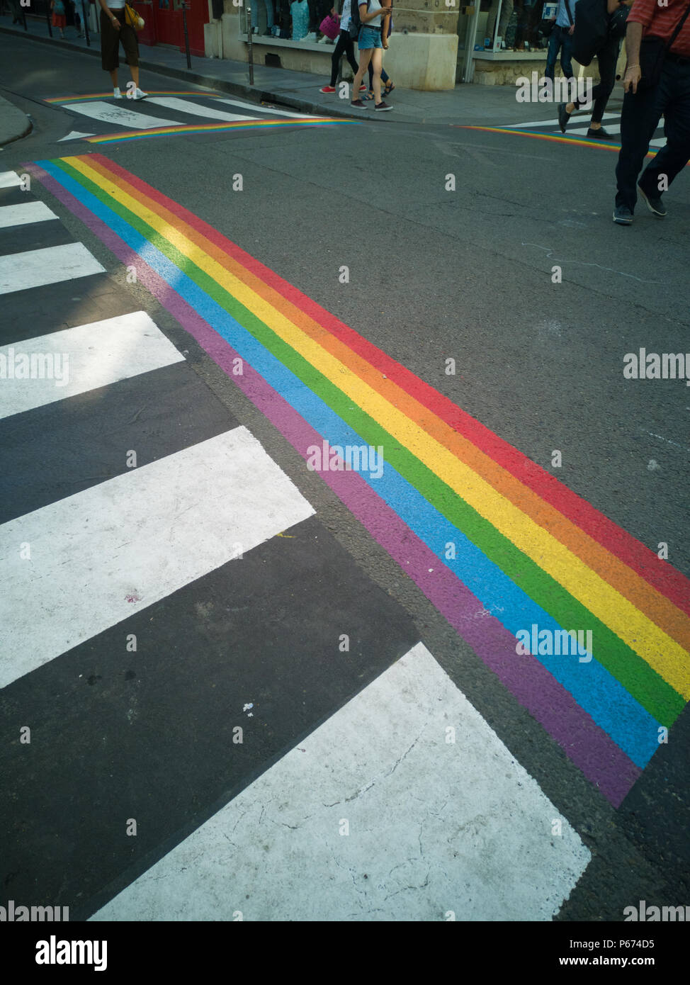 To prepare the gay pride in Paris pedestrian crosswalks were painted in the colors of the rainbow. Stock Photo