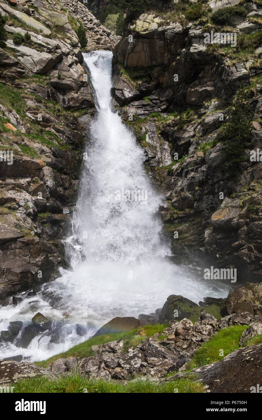 La Cua de Cavalt, Horses Tail, waterfall on the Rio de Nuria river in the Vall de Nuria flowing strongly full of water in the Pyreneean mountains, Cat Stock Photo