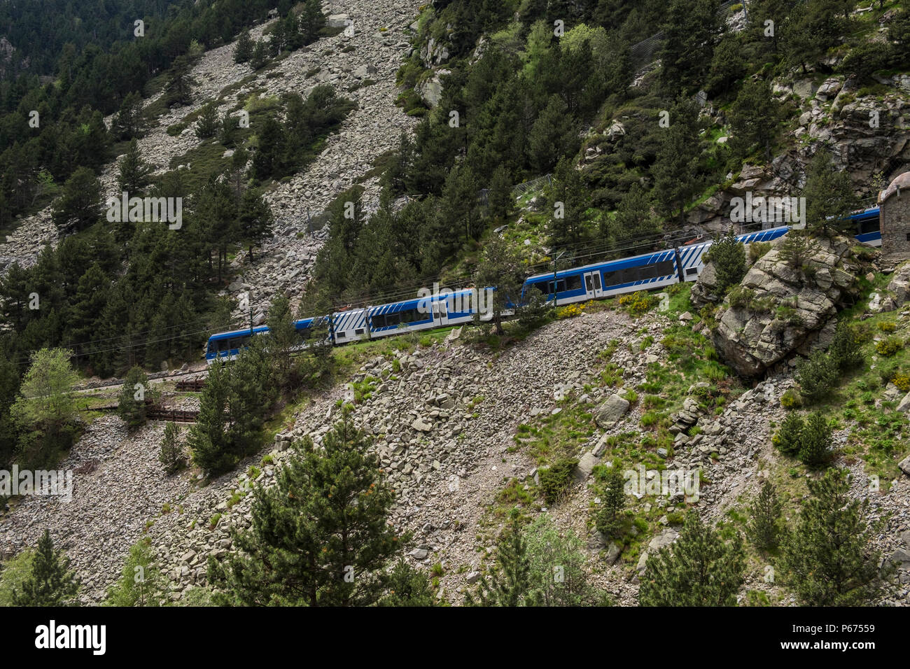The Cremellera rack and pinion train carriages making its way down the