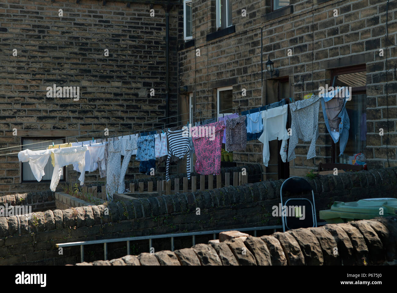 Family clean clothes laundry hanging out to dry north of England 2010s