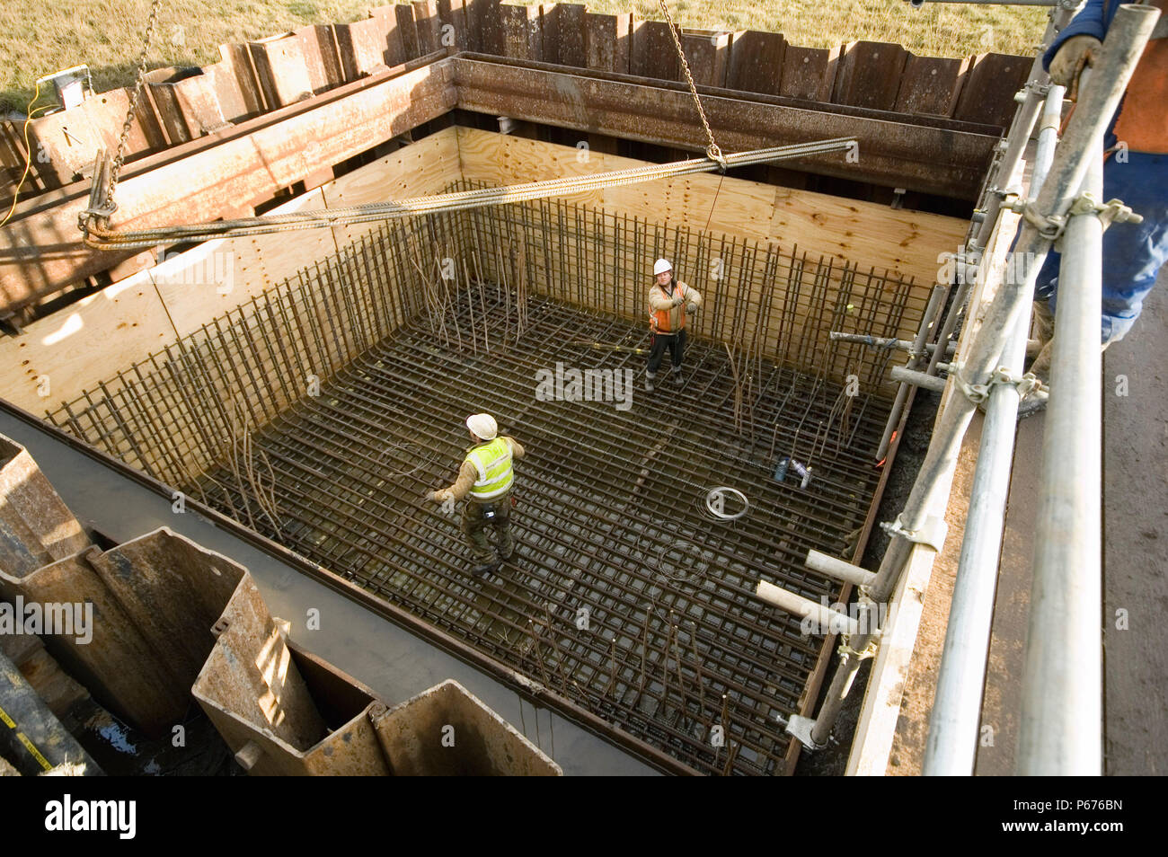 Steel fixers at work installing the reinforcing for the concrete