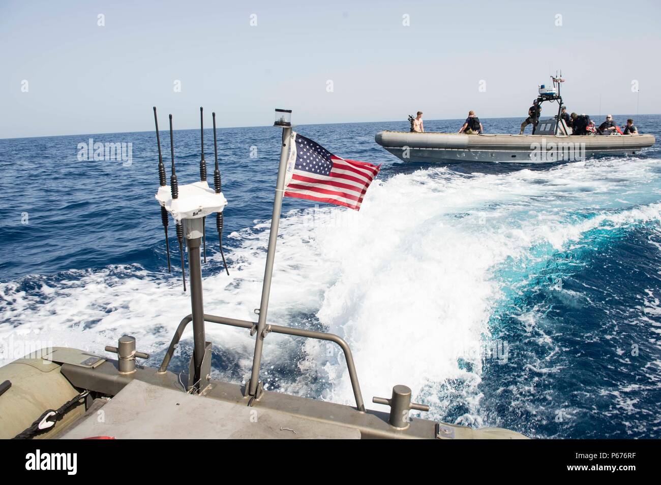 160516-N-VS214-199  RED SEA (May 16, 2016) A seven-meter rigid hull inflatable boat (RHIB) maneuvers in front of an 11-meter RHIB during a small boat training exercise for the boat crews of the dock landing ship USS Harpers Ferry (LSD 49). The crew of Harpers Ferry is part of about 3,000 U.S. military personnel – representing USCENTCOM headquarters and its components – who will participate in this year’s bilateral exercise, exercise Eager Lion 16, with the Jordan Armed Forces. (U.S. Navy photo by Mass Communication Specialist 3rd Class Zachary Eshleman/Released) Stock Photo