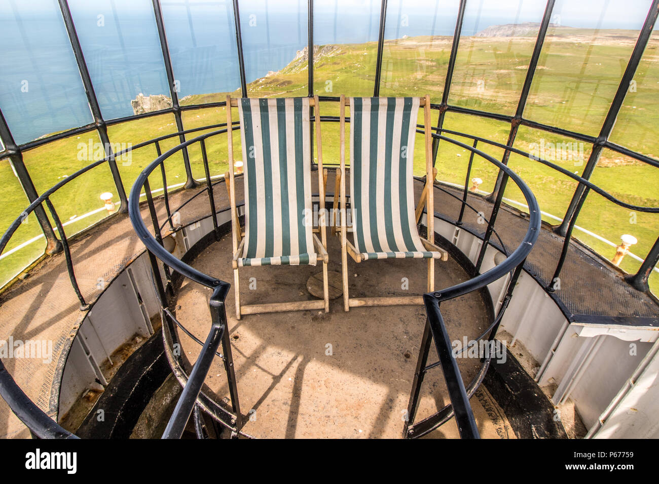 Two deckchairs at the top of Old Light Lighthouse on Lundy Island Stock