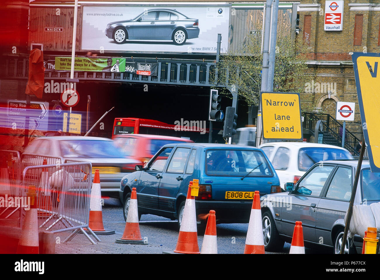 Vehicles negotiating traffic management at road works adjacent to Vauxhall station. London, United Kingdom. Stock Photo