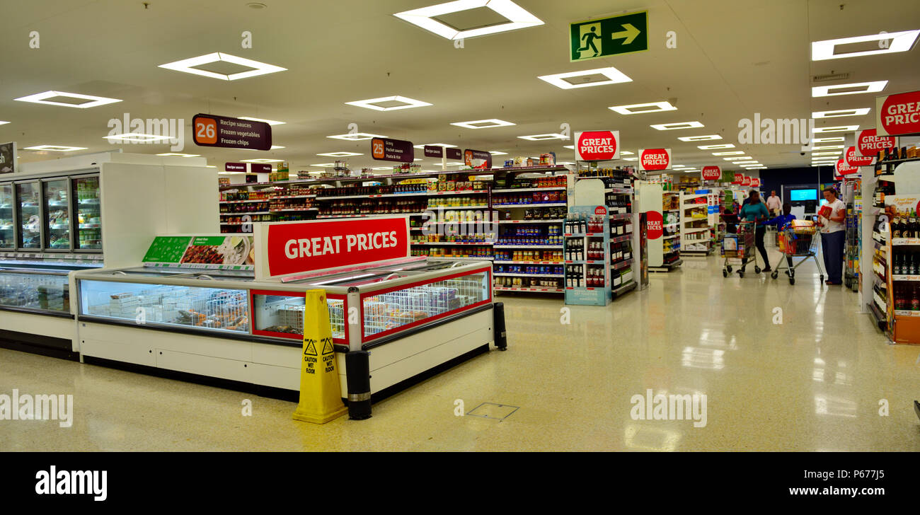 Inside Sainsbury's supermarket with shoppers in background, UK Stock Photo