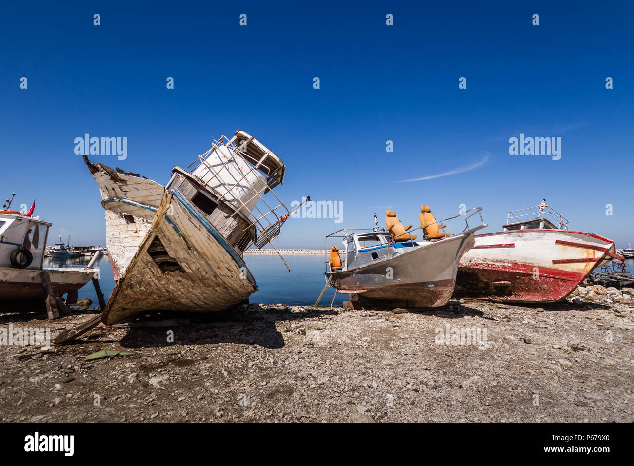 Old fishing boat abandoned on the shore Stock Photo - Alamy