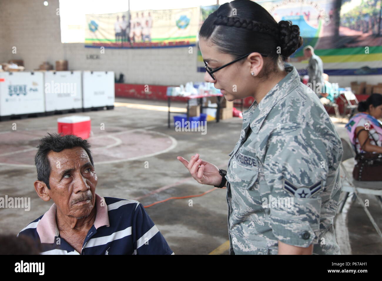 U.S. Air Force Airman 1st Class Georgina Cortez, with the 42nd Medical  Group, speaks with Guatemalan citizen, in La Blanca, Guatemala, May 24,  2016. Task Force Red Wolf and Army South conducts