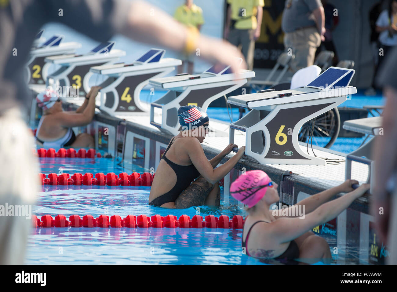 Christine Gauthier, Canada, left, Elizabeth Marks, United States, center, Anna Pollock, United Kingdom, right, prepare to compete in the 50 Meter Backstroke event during the 2016 Invictus Games, ESPN Wide World of Sports Complex, Orlando, Fla., May 11, 2016. The Invictus Games are an adaptive sports competition which was created by Prince Harry of the United Kingdom after he was inspired by the DoD Warrior Games. This event brings together wounded, ill, and injured service members and veterans from 15 nations for events including: archery, cycling, indoor rowing, powerlifting, sitting volleyba Stock Photo