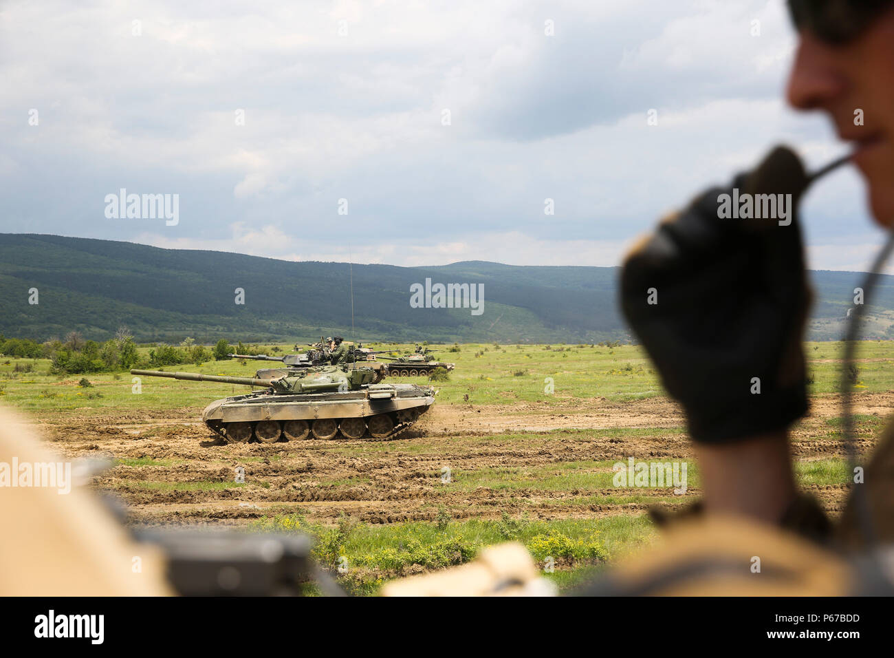 U.S. Marine Corps M1A1 Abrams tanks maneuver downrange alongside Bulgarian T-72 tanks for a tank integration exercise during Platinum Lion 16-3 aboard Novo Selo Training Area, Bulgaria May 11, 2016. During the exercise, Allies from the United States and four partner nations conducted platoon-level mechanized tactics in order to develop proficiency in fire and maneuver. (U.S. Marine Corps photo by Cpl. Immanuel M. Johnson/Released) Stock Photo