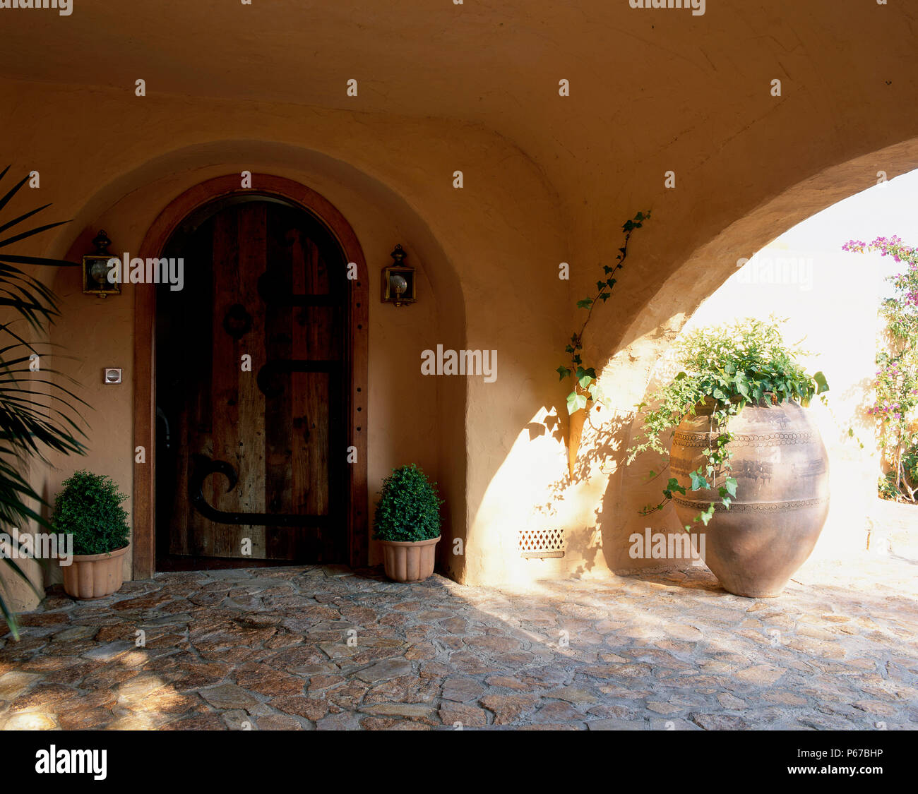 View of a porch decorated with pots Stock Photo