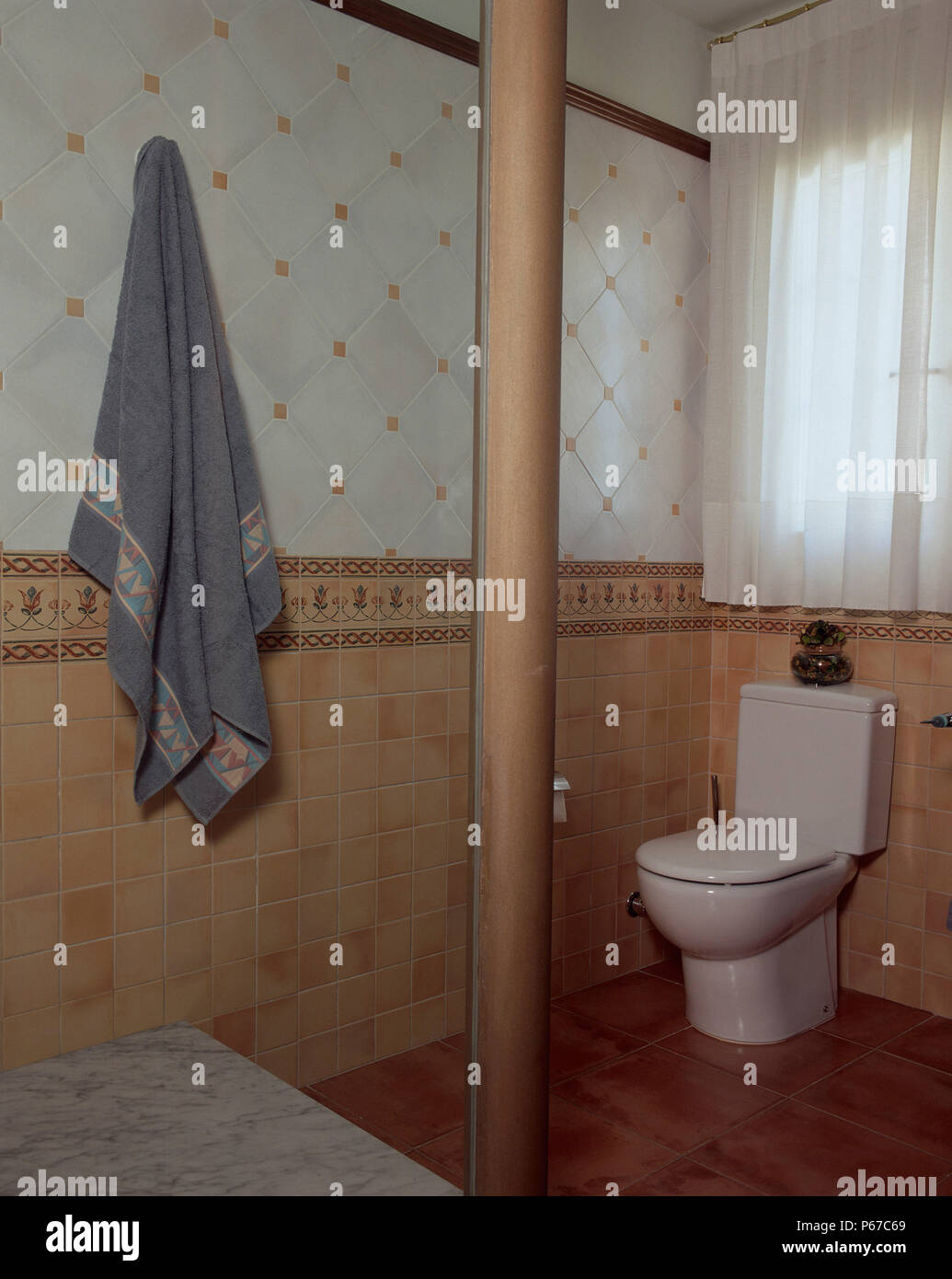 View of a toilet under a window Stock Photo Alamy
