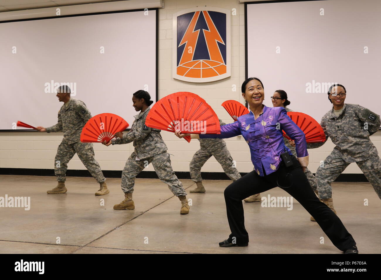 Hwee eng y lee teaches soldier a kung fu fan dance hires stock