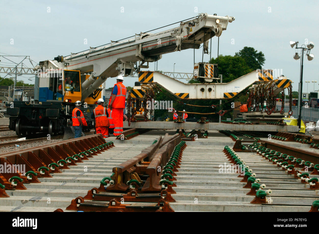 Balfour Beatty's Kirov Crane laying track panels at Tring station