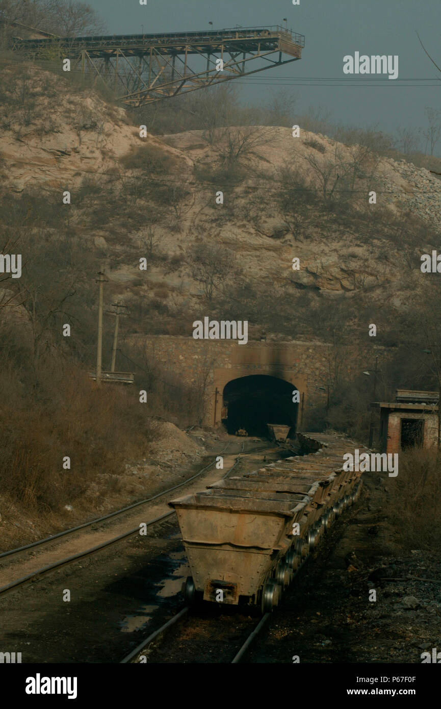 Beijing Limestone at Dahuichang in November 2004 with a rake of tubs being electrically cable hauled into the tunnel for loading through overhead chut Stock Photo
