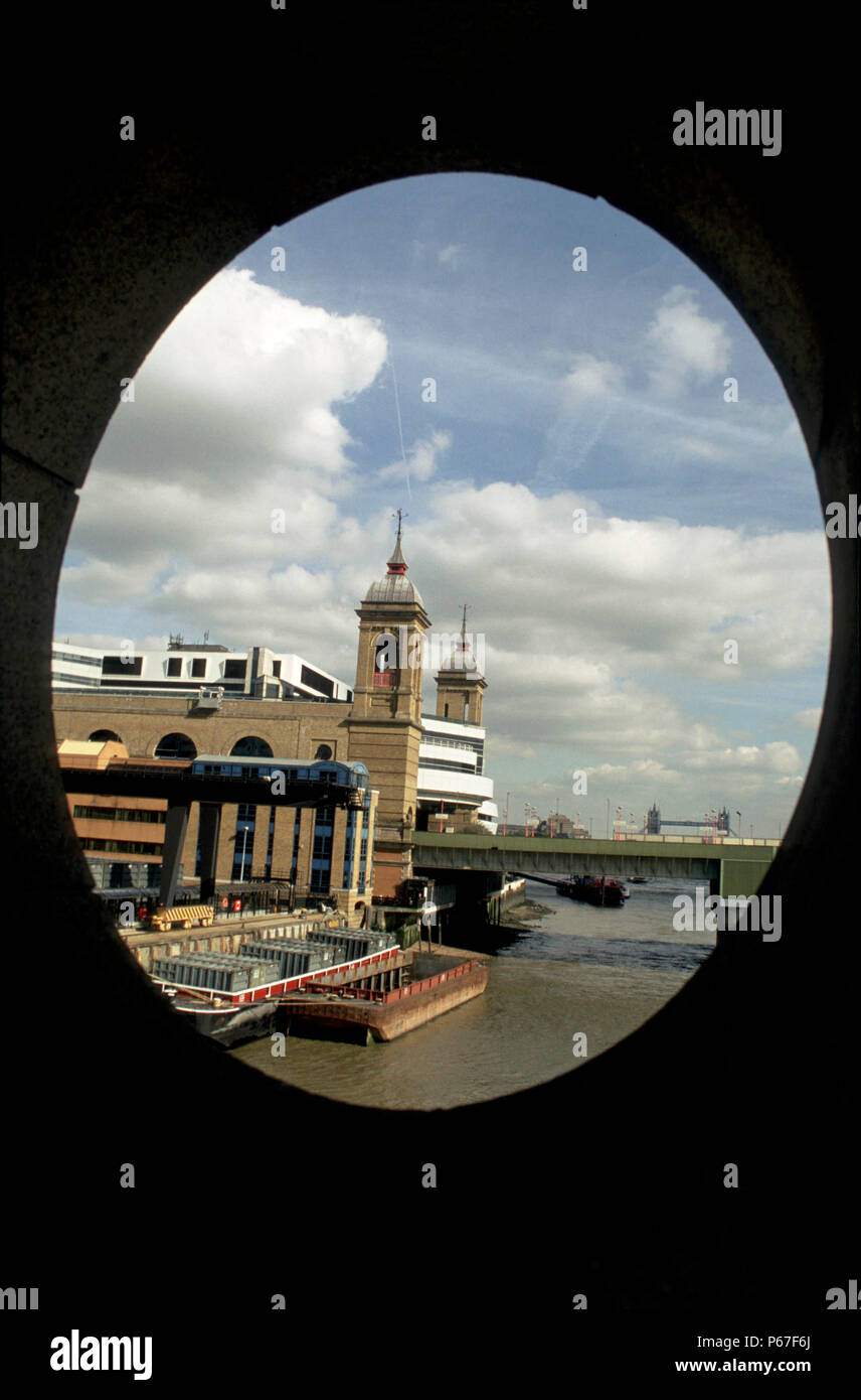 Cannon Street station next to the river Thames in London seen through the architecture of nearby Southwark Bridge. 2003. Stock Photo