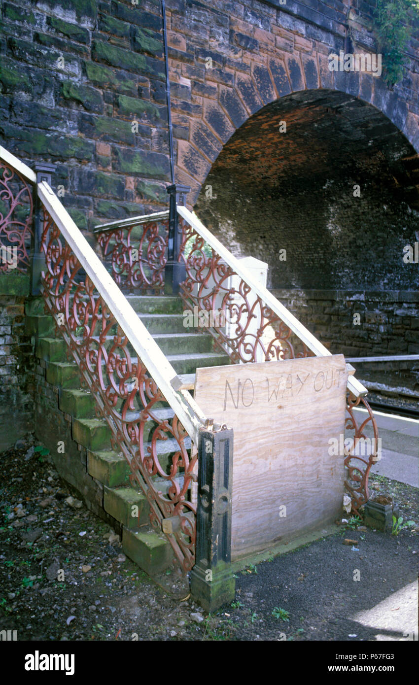 Derelect station footbridge with home made sign No way out. C 1993 Stock Photo