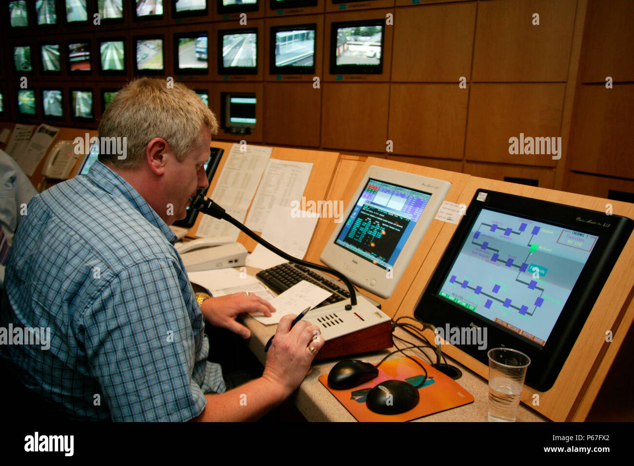 First Scotrail announcer keeps the public up to date with events from the Dunfirmline control centre. June 2005 Stock Photo