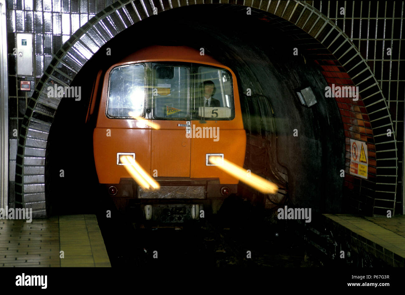 Glasgow underground train leaving a tunnel c1992 Stock Photo Alamy