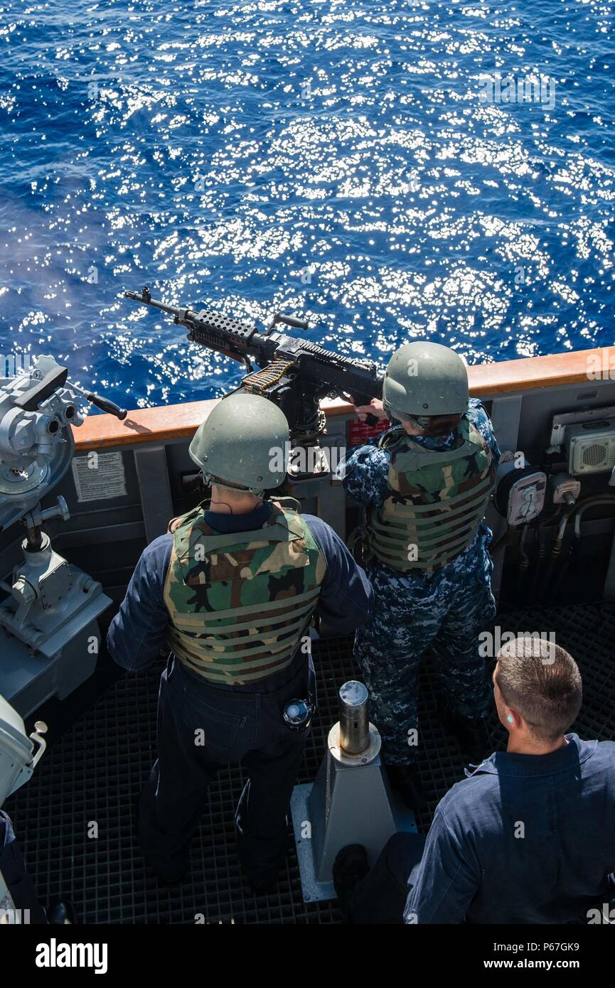 160509-N-XX566-278 SOUTH CHINA SEA (May 9, 2016) Gunner's Mate Seaman Ashley Koblitz shoots an M-240 machine-gun during a live fire exercise aboard the guided-missile destroyer USS Stockdale (DDG 106). Providing a ready force supporting security and stability in the Indo-Asia-Pacific, Stockdale is operating as part of the John C. Stennis Strike Group and Great Green Fleet on a regularly scheduled 7th Fleet deployment. (U.S. Navy photo by Mass Communication Specialist 3rd Class Andre T. Richard/Released) Stock Photo